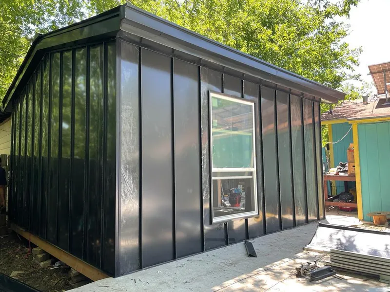 Black standing seam metal wall panels for Roof Inspection in Sandwich